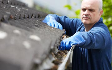 cleaning and inspecting Oran roofs